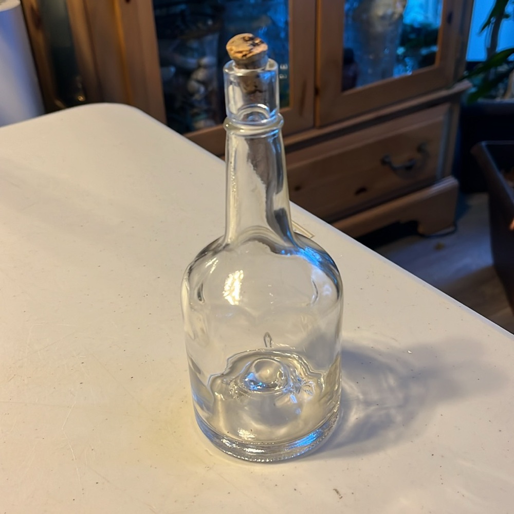 Vintage liquor bottle. Concave dimple button bottom round clear glass bottle crk